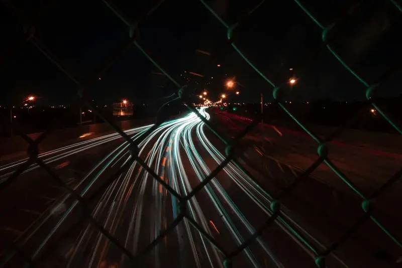 A blurry photo of a city street at night